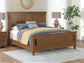 Rowlenstown King Poster Bed with Mirrored Dresser